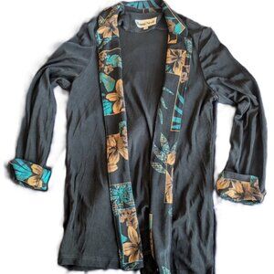 Flowy black jacket with patterned labels/cuffs. by Ronni Nicole